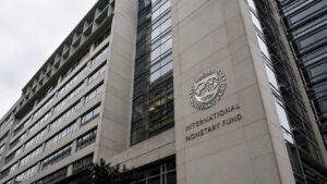 IMF headquarters building in Washington D.C. showing the International Monetary Fund logo and name on the exterior facade.