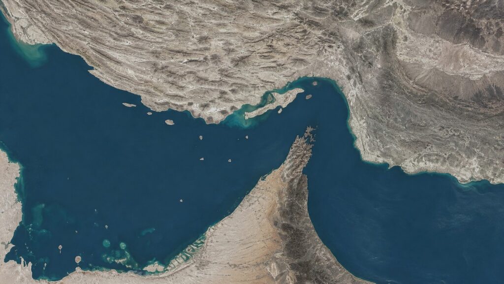 Satellite view of the Strait of Hormuz — the chokepoint at the center of the gold price Hormuz tanker strike story.