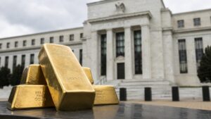Gold bars stacked in front of the Federal Reserve building representing gold stagflation and monetary policy uncertainty