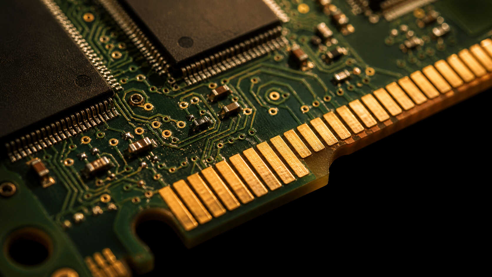 Gold-plated edge connectors on a circuit board — AI server components are a growing source of gold demand in 2026