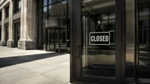 Closed sign on the glass door of a financial institution building on Juneteenth — US gold price markets closed June 19 2026