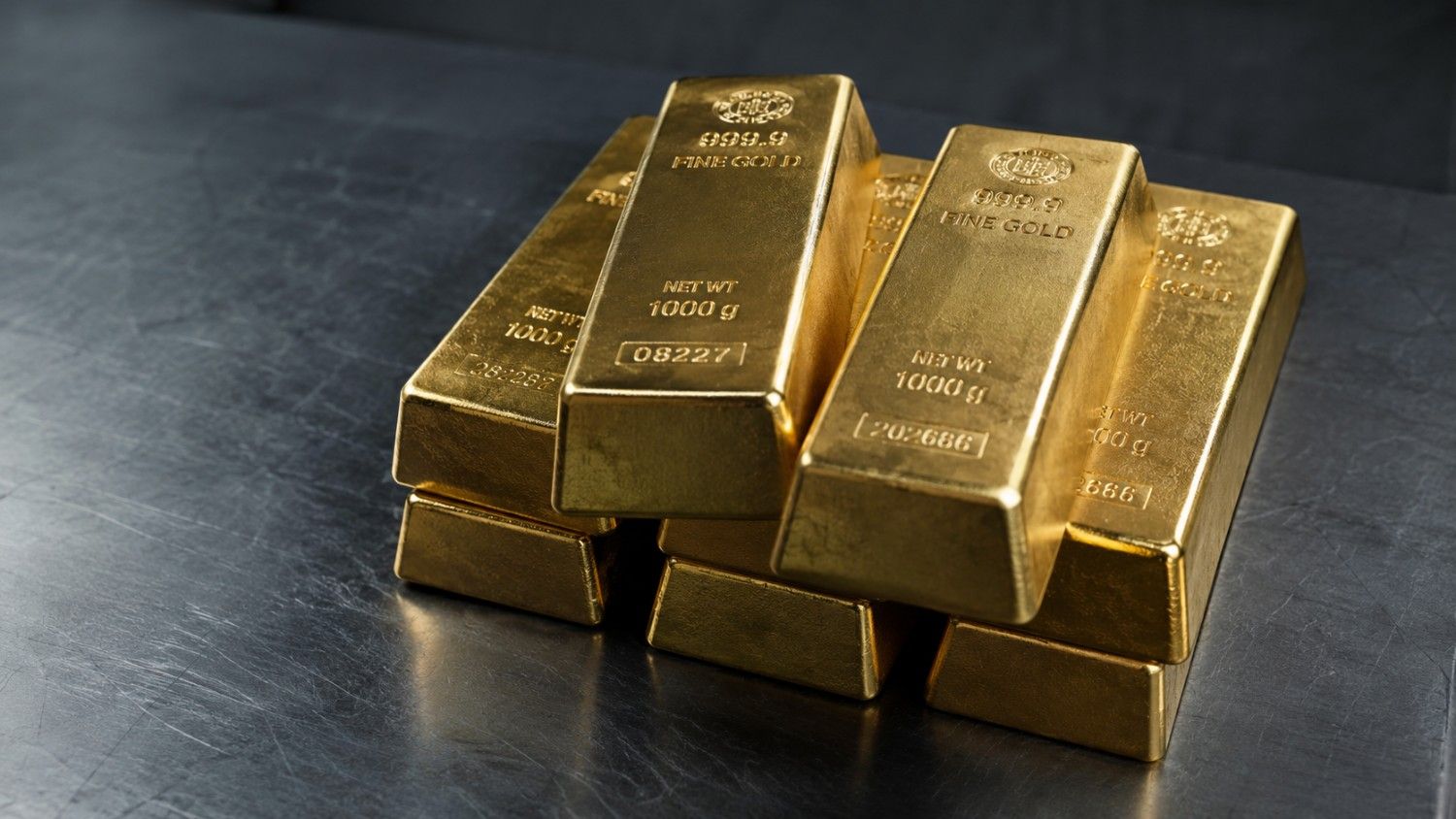 Institutional gold bars stacked on steel — 999.9 fine gold, 1000g, gold silver prices today