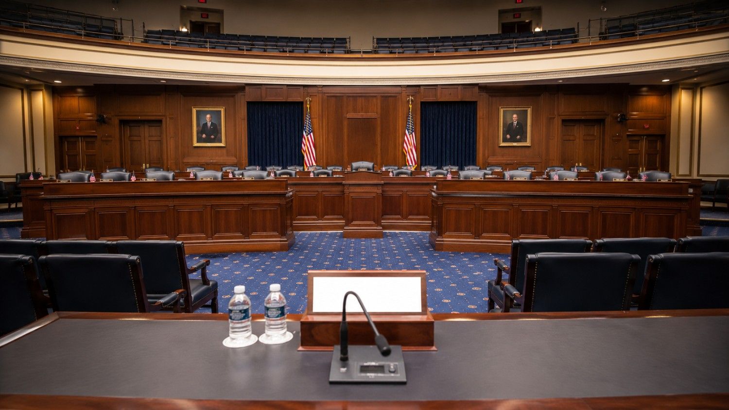 Empty congressional hearing room awaiting Fed Chair Warsh testimony on gold price impact of June CPI and July 2026 rate decision
