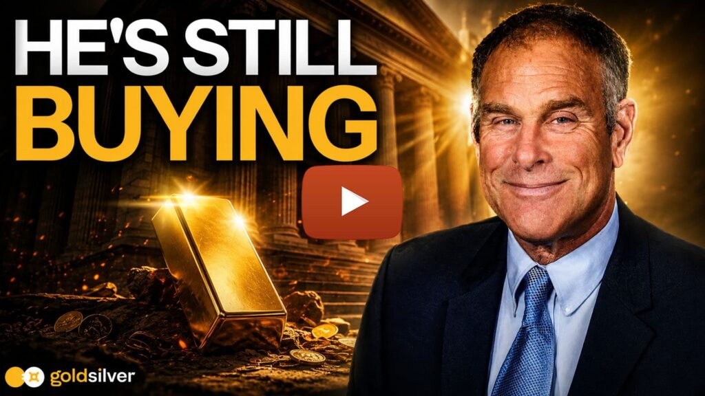 Rick Rule of GoldSilver next to a gold bar and coins, illustrating why saving in gold is a good idea for long-term investors