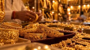 Close-up of gold bangles and jewelry displayed in a traditional Indian jewelry shop, representing household gold demand amid rising import duties